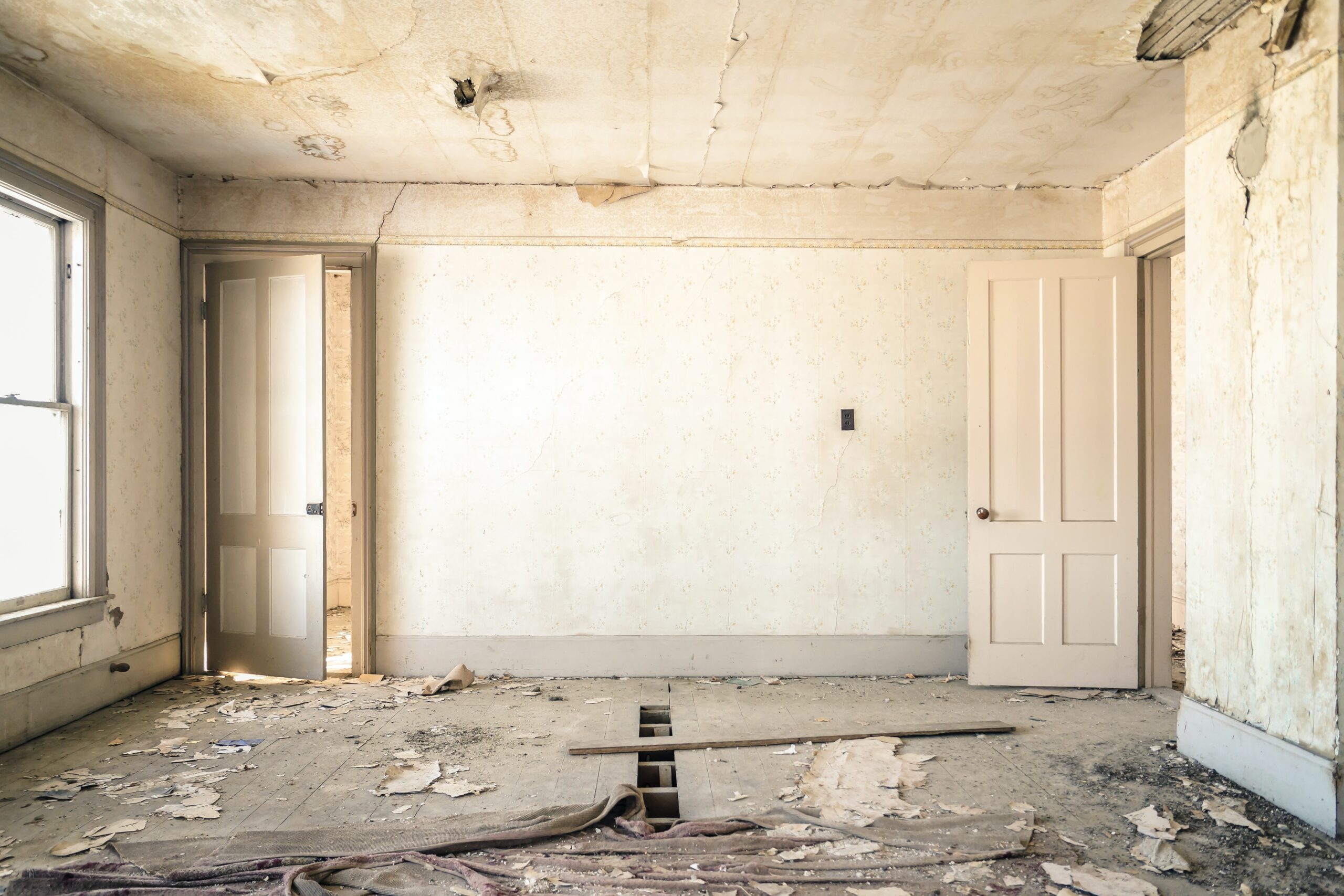 Grey concrete walls with broken floor